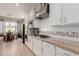 Well-appointed kitchen with white cabinetry, stainless steel appliances, and granite countertops at 31107 N 27Th Ave, Phoenix, AZ 85085