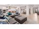Spacious living room showcasing modern decor, a large sectional, and an open layout at 31107 N 27Th Ave, Phoenix, AZ 85085