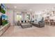 Bright living room featuring a large sectional sofa, ample windows, and an open floor plan at 31107 N 27Th Ave, Phoenix, AZ 85085