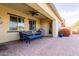Covered patio area with outdoor dining set, providing shade and a spot for entertaining at 31107 N 27Th Ave, Phoenix, AZ 85085