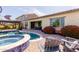 Relaxing backyard pool and patio area with desert landscaping and seating, perfect for outdoor entertaining at 31107 N 27Th Ave, Phoenix, AZ 85085