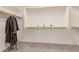 This walk-in closet has wood shelving and a neutral carpet at 31107 N 27Th Ave, Phoenix, AZ 85085