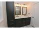 Bathroom features a double sink vanity, mirrors, sconces and storage at 3310 W Sweetwater Ave, Phoenix, AZ 85029