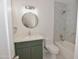 Stylishly updated bathroom with marble patterned tile, updated vanity and toilet at 3310 W Sweetwater Ave, Phoenix, AZ 85029