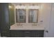 Double sink bathroom vanity, featuring two mirrors and shaker-style cabinetry at 3310 W Sweetwater Ave, Phoenix, AZ 85029