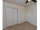 This bedroom has carpet, large closets and new trim paint at 3310 W Sweetwater Ave, Phoenix, AZ 85029