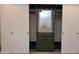 A stylish closet with sliding doors, a built-in mirror, and a drawer for optimal storage solutions at 3310 W Sweetwater Ave, Phoenix, AZ 85029