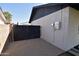 Gravel driveway leading to a black gate attached to the property's painted white brick fence at 3310 W Sweetwater Ave, Phoenix, AZ 85029