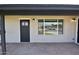 Inviting front porch featuring a stylish brick patio, modern lighting, and attractive front door at 3310 W Sweetwater Ave, Phoenix, AZ 85029