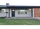 Charming front porch enhanced with a new brick pathway and updated fixtures at 3310 W Sweetwater Ave, Phoenix, AZ 85029