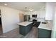 Modern kitchen with new stainless steel appliances, center island, stylish cabinets, and updated fixtures at 3310 W Sweetwater Ave, Phoenix, AZ 85029