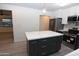 Modern kitchen with an island and stainless steel appliances at 3310 W Sweetwater Ave, Phoenix, AZ 85029