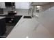 This kitchen boasts light countertops, stainless appliances and new fixtures at 3310 W Sweetwater Ave, Phoenix, AZ 85029