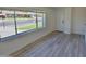 Bright living room with durable floors and a large window offering a street view at 3310 W Sweetwater Ave, Phoenix, AZ 85029