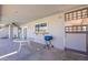 The back porch offers a grill, a window, and a door to the exterior at 3408 W Carol Ave, Phoenix, AZ 85051
