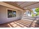 Back porch offers a decorative ceiling and tile flooring at 3408 W Carol Ave, Phoenix, AZ 85051