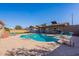 Backyard featuring a sparkling pool, lounge chairs, and ample space for entertaining at 3408 W Carol Ave, Phoenix, AZ 85051