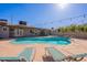Private backyard oasis featuring a sparkling pool, lounge chairs, and outdoor lighting at 3408 W Carol Ave, Phoenix, AZ 85051