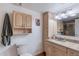 Well-lit bathroom featuring ample cabinet space and modern fixtures at 3408 W Carol Ave, Phoenix, AZ 85051