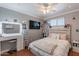 Bright bedroom features a large bed, vanity and modern decor at 3408 W Carol Ave, Phoenix, AZ 85051
