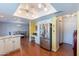 Open kitchen boasts granite countertops, stainless appliances, and seamless flow to dining at 3408 W Carol Ave, Phoenix, AZ 85051
