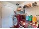 Functional laundry room with washer, dryer, shelving, and storage space at 3408 W Carol Ave, Phoenix, AZ 85051