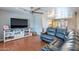 Spacious living room features hardwood floors, modern furniture, and bright lighting at 3408 W Carol Ave, Phoenix, AZ 85051