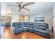Open living room with hardwood floors and a comfortable sectional sofa at 3408 W Carol Ave, Phoenix, AZ 85051
