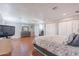 Spacious main bedroom with a large bed, dresser, and walk-in closets at 3408 W Carol Ave, Phoenix, AZ 85051