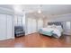 An elegant main bedroom with a large bed, seating area, and closet space at 3408 W Carol Ave, Phoenix, AZ 85051