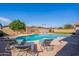 A private swimming pool provides a serene outdoor oasis for relaxation at 3408 W Carol Ave, Phoenix, AZ 85051