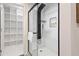 Modern bathroom featuring a stand-up shower, shelving and rain shower head at 3615 E Charter Oak Rd, Phoenix, AZ 85032