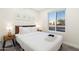 Relaxing bedroom with a plush bed, side table, and decor at 3615 E Charter Oak Rd, Phoenix, AZ 85032