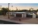 This single-story home features desert landscaping, mountain views, a gated pool and a brick driveway at 3615 E Charter Oak Rd, Phoenix, AZ 85032