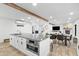 Bright, modern kitchen with stainless appliances and a large island and breakfast bar at 3615 E Charter Oak Rd, Phoenix, AZ 85032