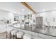 Gourmet kitchen with white cabinets, oversized island, and stainless steel appliances at 3615 E Charter Oak Rd, Phoenix, AZ 85032