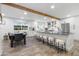 Bright, open kitchen features a large island with seating and stainless steel appliances at 3615 E Charter Oak Rd, Phoenix, AZ 85032