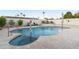 Resort-style pool with a built-in spa, patio and lush landscaping at 3615 E Charter Oak Rd, Phoenix, AZ 85032