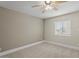 Bright bedroom with neutral walls, carpet flooring, white trim and a large window at 3825 E Camelback Rd # 117, Phoenix, AZ 85018