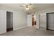 Cozy bedroom featuring neutral walls, carpet flooring, ceiling fan, and closet space at 3825 E Camelback Rd # 117, Phoenix, AZ 85018