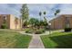 Beautifully maintained community grounds with lush landscaping and walking paths at 3825 E Camelback Rd # 117, Phoenix, AZ 85018