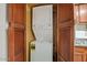 Convenient in-unit stacked washer and dryer, surrounded by wood cabinetry at 3825 E Camelback Rd # 117, Phoenix, AZ 85018
