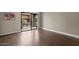 Living room with beautiful hardwood floors and access to a relaxing private balcony at 3825 E Camelback Rd # 117, Phoenix, AZ 85018