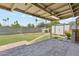 Covered patio with a brick floor overlooking a grassy yard and block wall at 400 N Jay N St, Chandler, AZ 85225
