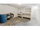 Unfinished basement includes workbench with storage and concrete floors at 400 N Jay N St, Chandler, AZ 85225