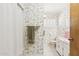 Charming bathroom with floral wallpaper, a shower with curtain, and a classic vanity at 400 N Jay N St, Chandler, AZ 85225