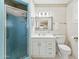Bright bathroom featuring a vanity with a framed mirror and a glass-enclosed shower at 400 N Jay N St, Chandler, AZ 85225