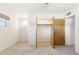 Bedroom with neutral carpet, closet with open doors, and natural light at 400 N Jay N St, Chandler, AZ 85225