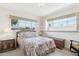 Cozy bedroom with a large window, carpeted floors, and classic furnishings, offering a relaxing retreat at 400 N Jay N St, Chandler, AZ 85225