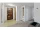 Foyer featuring a tiled floor, decorative door, and brick hearth at 400 N Jay N St, Chandler, AZ 85225
